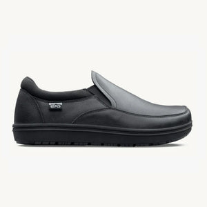 Black slip-on casual shoe with minimalist design, rounded toe, and flexible sole.