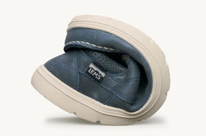 Foldable blue canvas casual shoe with white rubber sole and Lems logo tag on side.