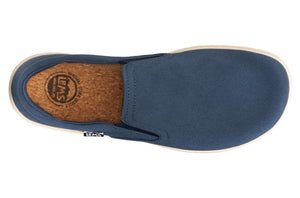 Navy blue slip-on casual shoe with cork insole and white sole.