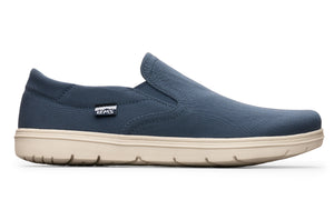 Navy blue slip-on casual shoe with elastic side panels and beige rubber sole.