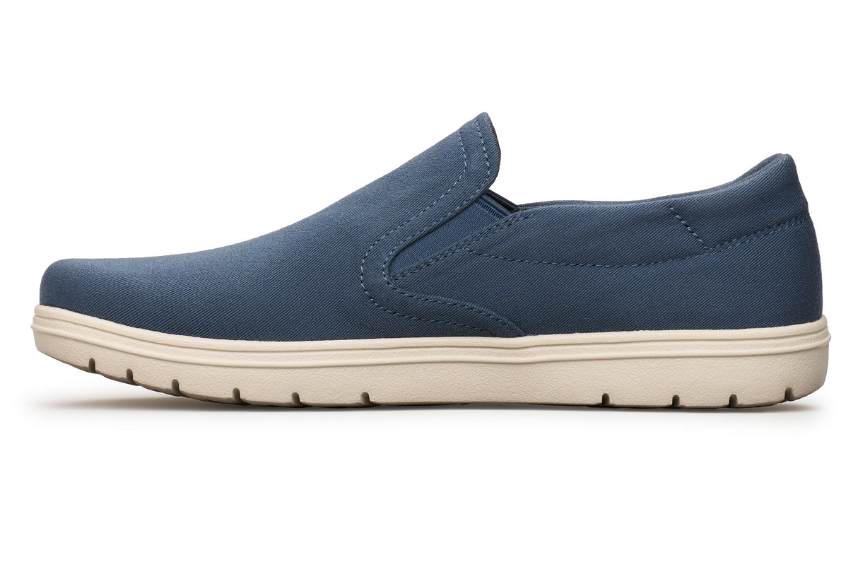 Navy blue slip-on casual shoe with beige rubber sole and elastic side panels.