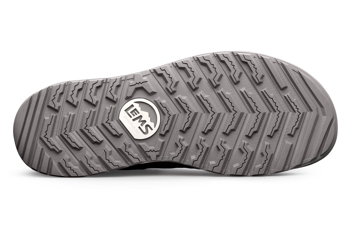 Gray rubber outsole with deep multi-directional tread pattern and Lems logo in center.