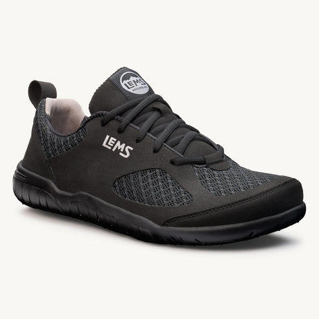 Black Lems Primal 3 athletic shoe with mesh panels, stitching detail, and textured sole.