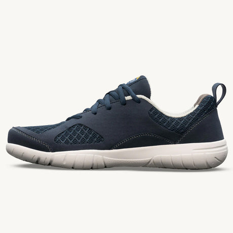 Navy blue athletic sneaker with mesh panels, white cushioned sole, and rear pull tab.