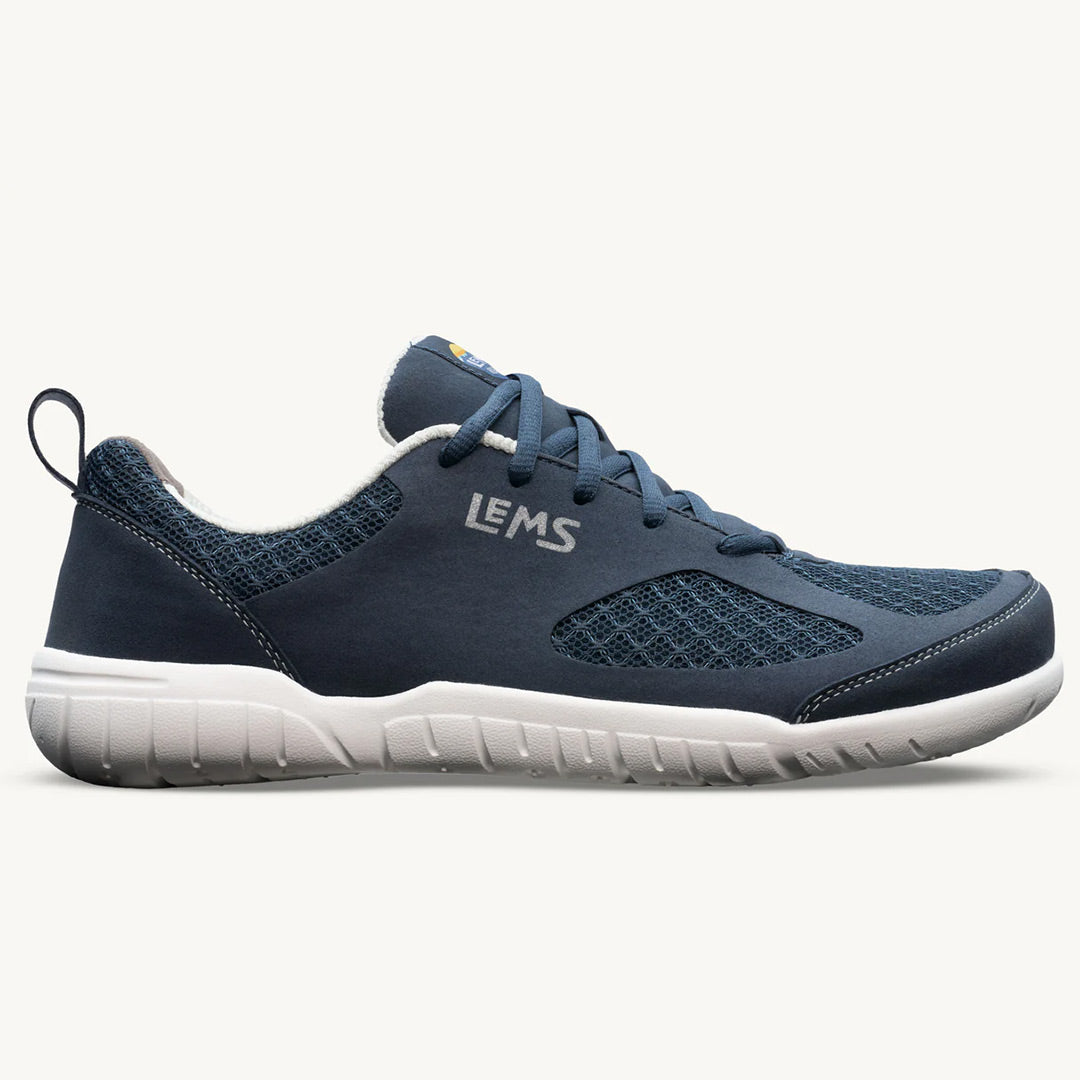 Navy blue Lems Primal 3 athletic shoe with breathable mesh upper and white flexible sole.