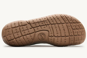 Olive green sole of Lems Primal 3 shoe with textured tread pattern and circular logo near heel.