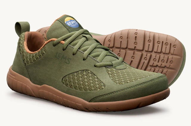 Olive green athletic casual shoe with mesh panels, lace-up design, and brown rubber sole.