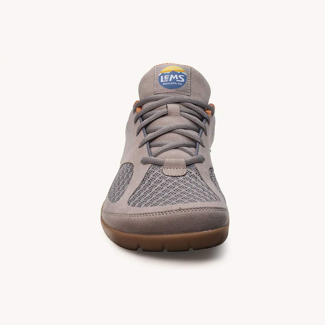 Slate gray athletic shoe with mesh upper, lace-up front, and tan rubber sole.