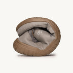 Flexible slate gray Lems Primal 3 sneaker bent to show foldability and brown rubber sole.