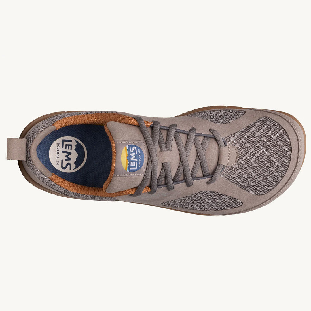 Slate gray athletic shoe with mesh upper, padded collar, and tan accents from Lems Primal 3 series.