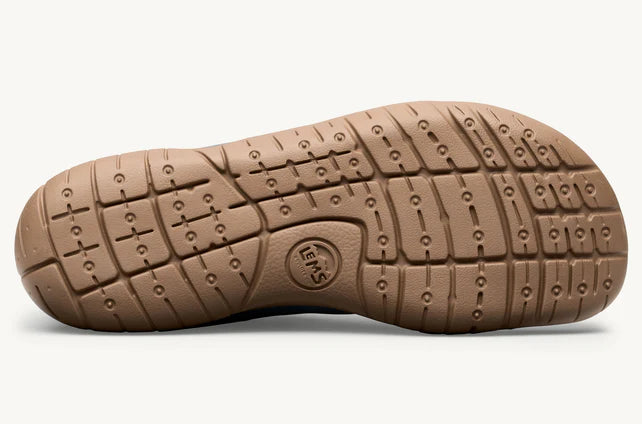 Brown rubber sole with flexible grooves and circular grip patterns for athletic and casual wear.