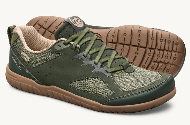 Green and beige low-top athletic shoe with gum sole and lace-up design.