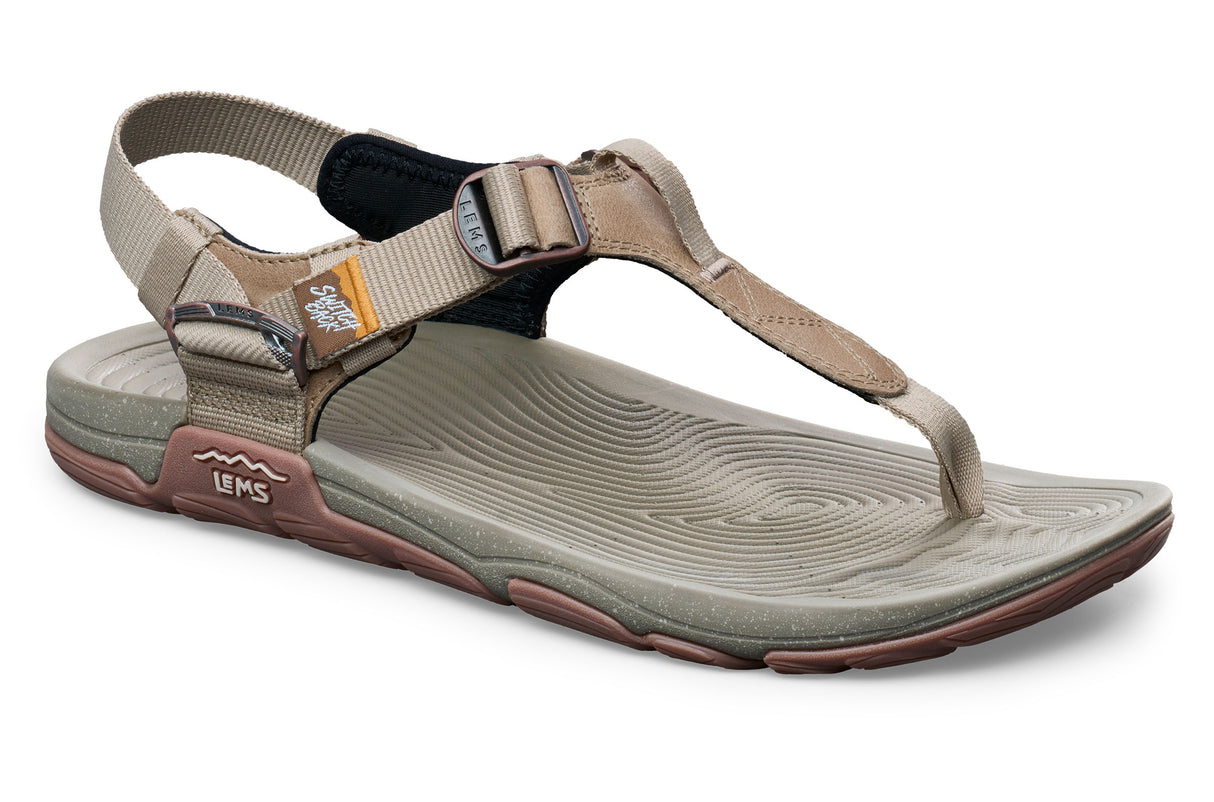 Beige and olive casual sandal with adjustable straps and textured footbed, sporty open design.