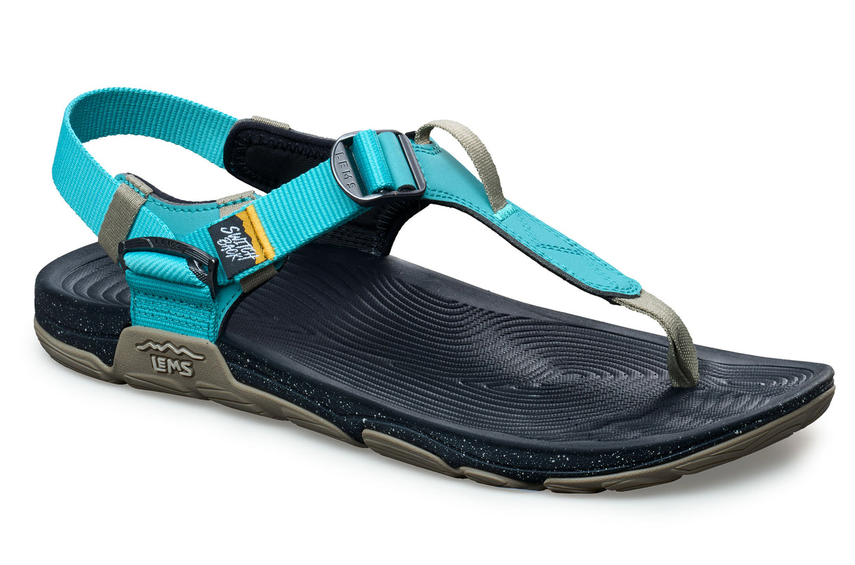 Teal and black casual sandal with adjustable straps and textured footbed, Lems Switchback Oasis.