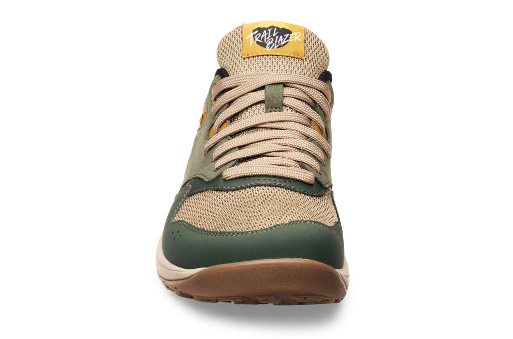 Green and beige Lems Trail Blazer Juniper casual sneaker with tan laces and gum sole, front view.