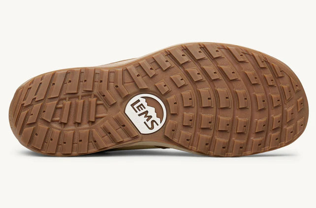 Brown rubber outsole of Lems Trail Blazer shoe with square tread pattern and Lems logo center.