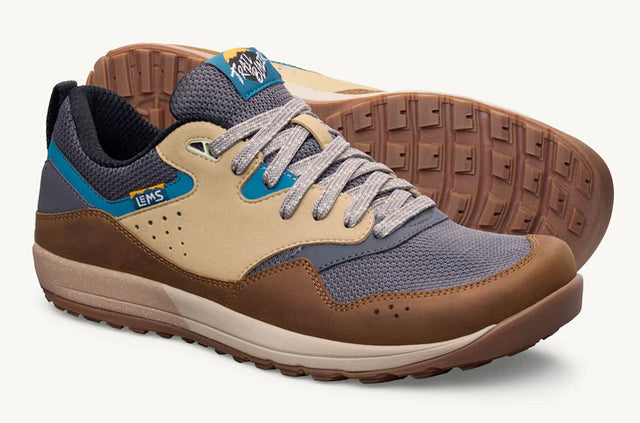 Casual Lems Trail Blazer sneaker in brown, beige, gray mesh with blue and tan accents, white laces, and textured brown sole.