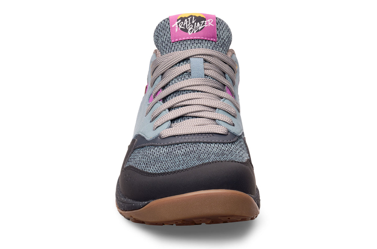 Gray and black Lems Trail Blazer sneaker with pink accents and gum sole, front view.