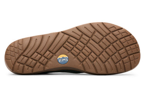 Black rubber outsole with multidirectional tread pattern and circular Lems logo in center.