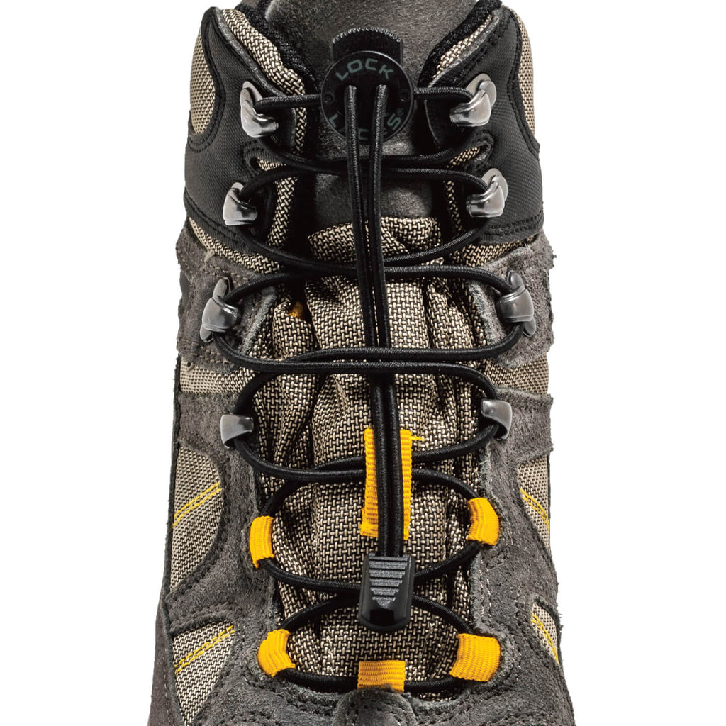 Black no-tie Lock Laces threaded through gray hiking boot eyelets with yellow accents.