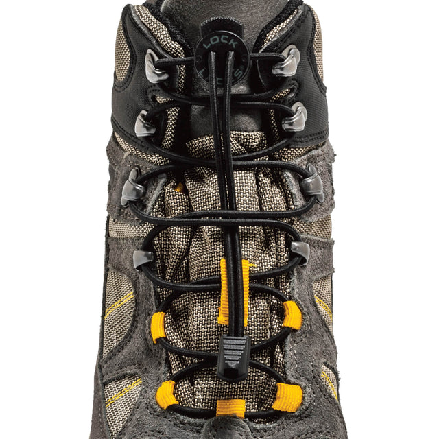 Black no-tie Lock Laces threaded through gray hiking boot eyelets with yellow accents.