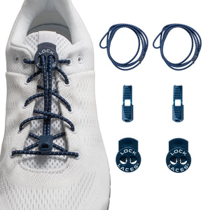 Navy blue Lock Laces no-tie shoelaces on white sneaker with locking clips and end caps displayed separately.