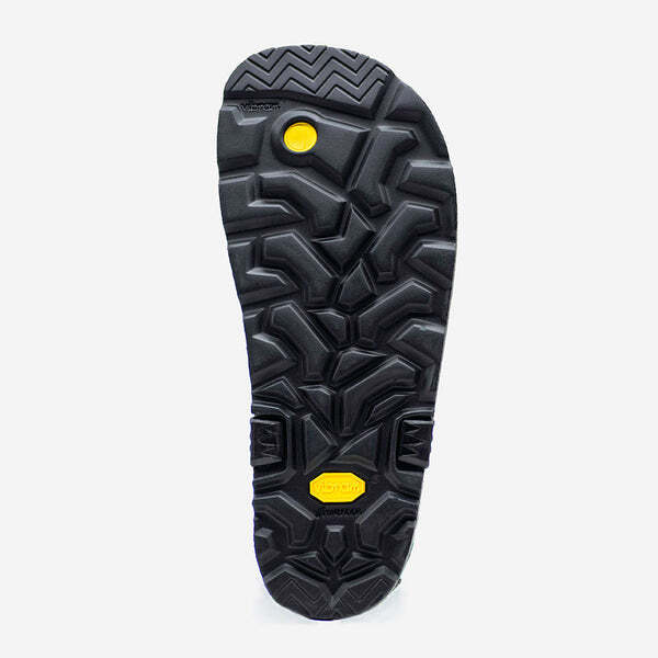 Black Luna Sandals Mono Winged Edition sole with deep geometric tread and yellow accents.