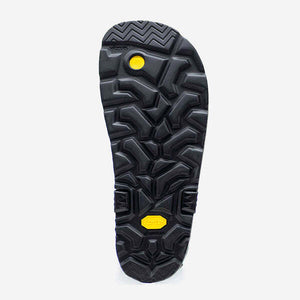 Black Luna Sandals Mono Winged Edition sole with deep geometric tread and yellow accents.