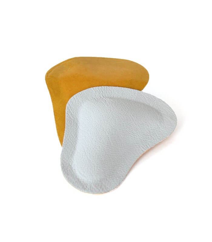 White and beige metatarsal pads with contoured ergonomic shape for foot support.