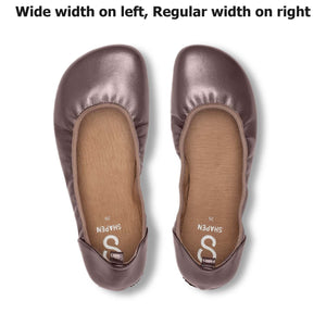 Wide bronze satin ballet flats with rounded toes, shown with left shoe wider than right.