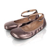 Bronze shiny barefoot ballerina flats with ankle straps and rounded toes on reflective surface.