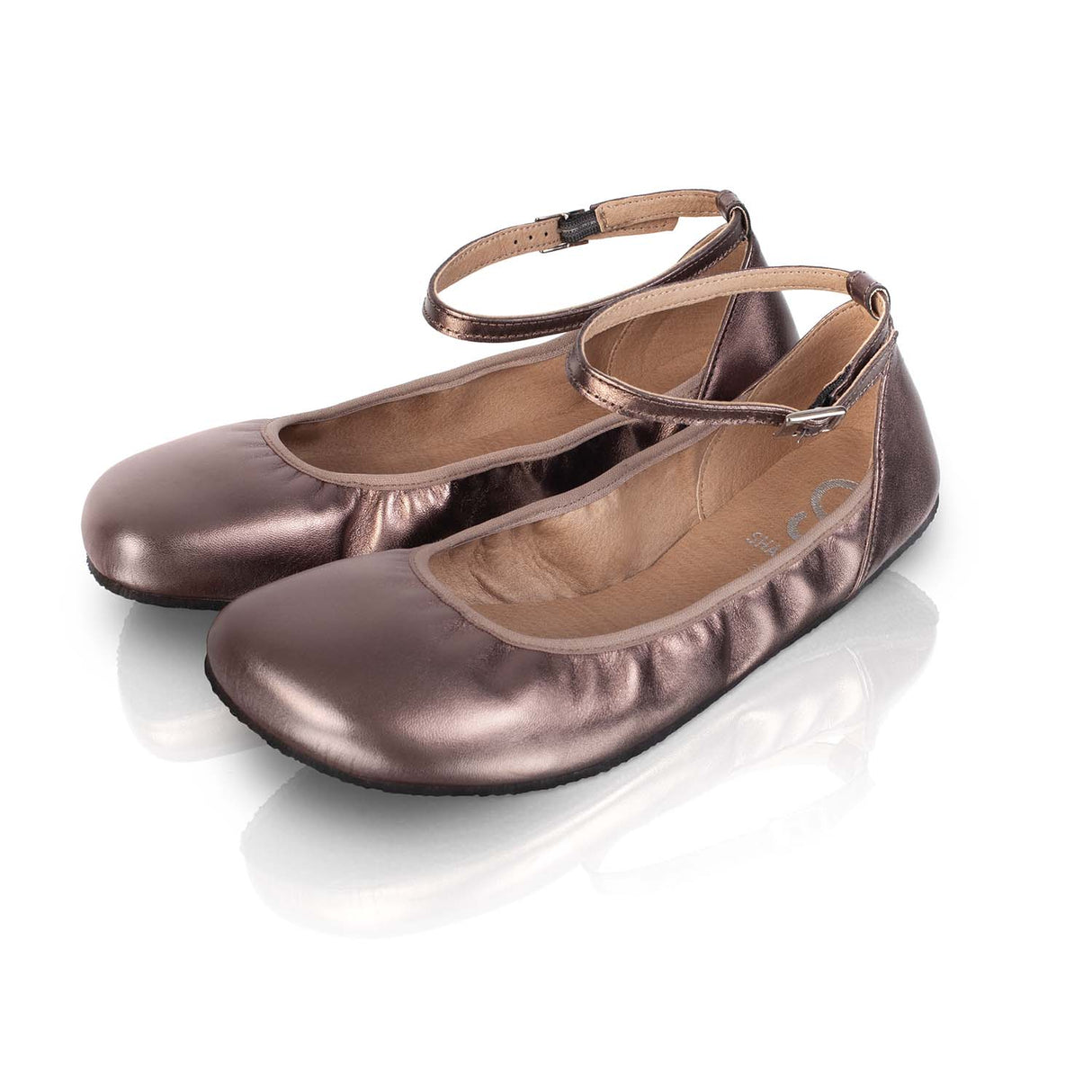 Bronze shiny barefoot ballerina flats with ankle straps and rounded toes on reflective surface.
