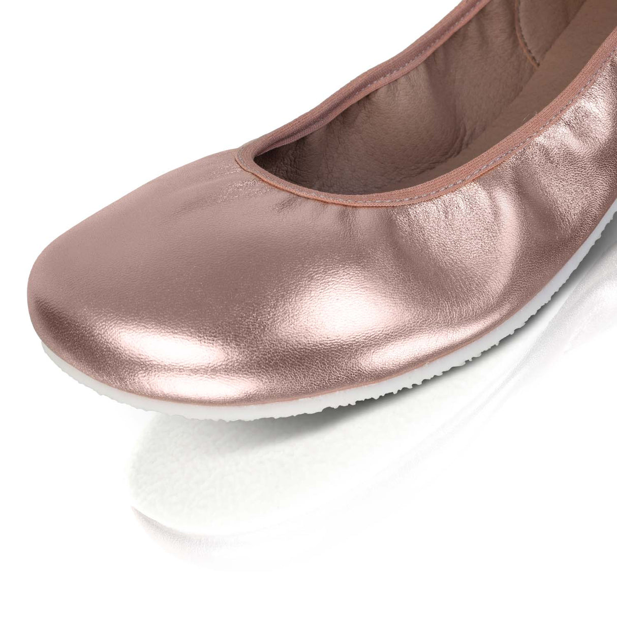 Rose gold wide ballerina flat with smooth metallic finish and rounded toe.