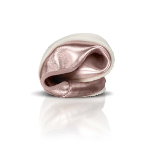 Rose gold metallic barefoot ballerina shoe folded to show flexibility with white sole.
