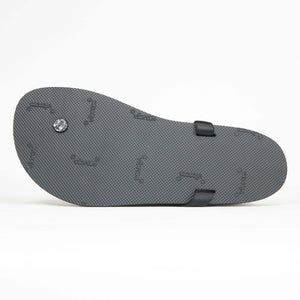 Black textured sole of Shamma Cruzers Ultragrip sandal with embossed logo and two strap loops.
