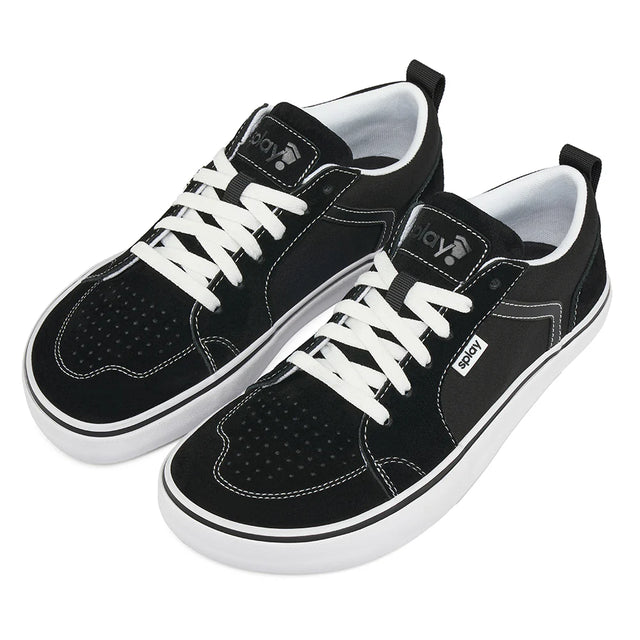 Black sneakers with white laces on a white background