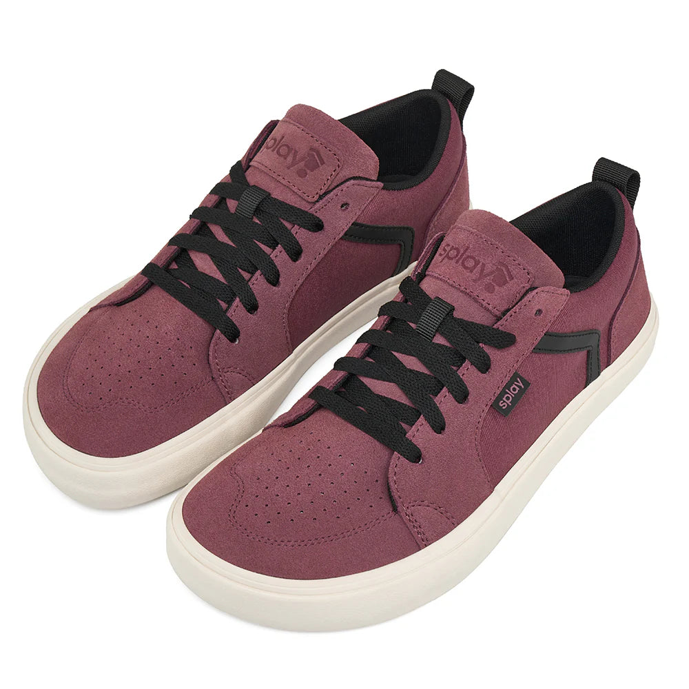 Pair of maroon sneakers with black laces on a white background