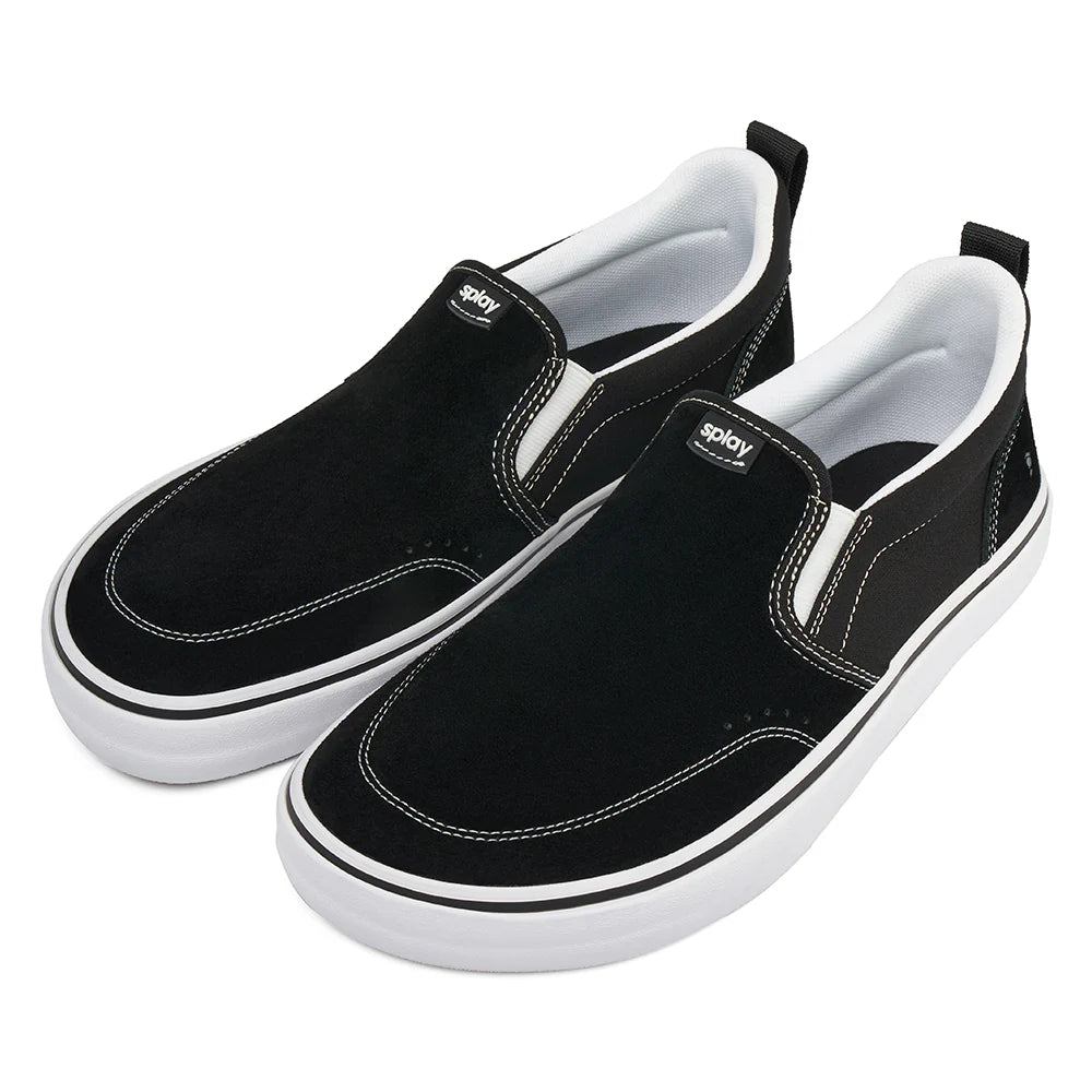 Black slip-on sneakers with white soles on a white background