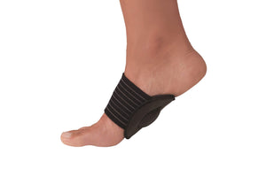 Beige Strutz Pro metatarsal pad with black elastic straps worn on foot.