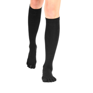Black knee-high toe socks with separate toe compartments on a model's legs.