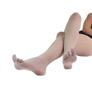 Beige sheer nylon toe tights worn on feet and legs against white background.