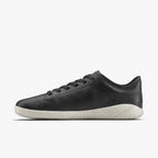Sleek black leather low-top sneaker with minimalist design and white rubber sole.