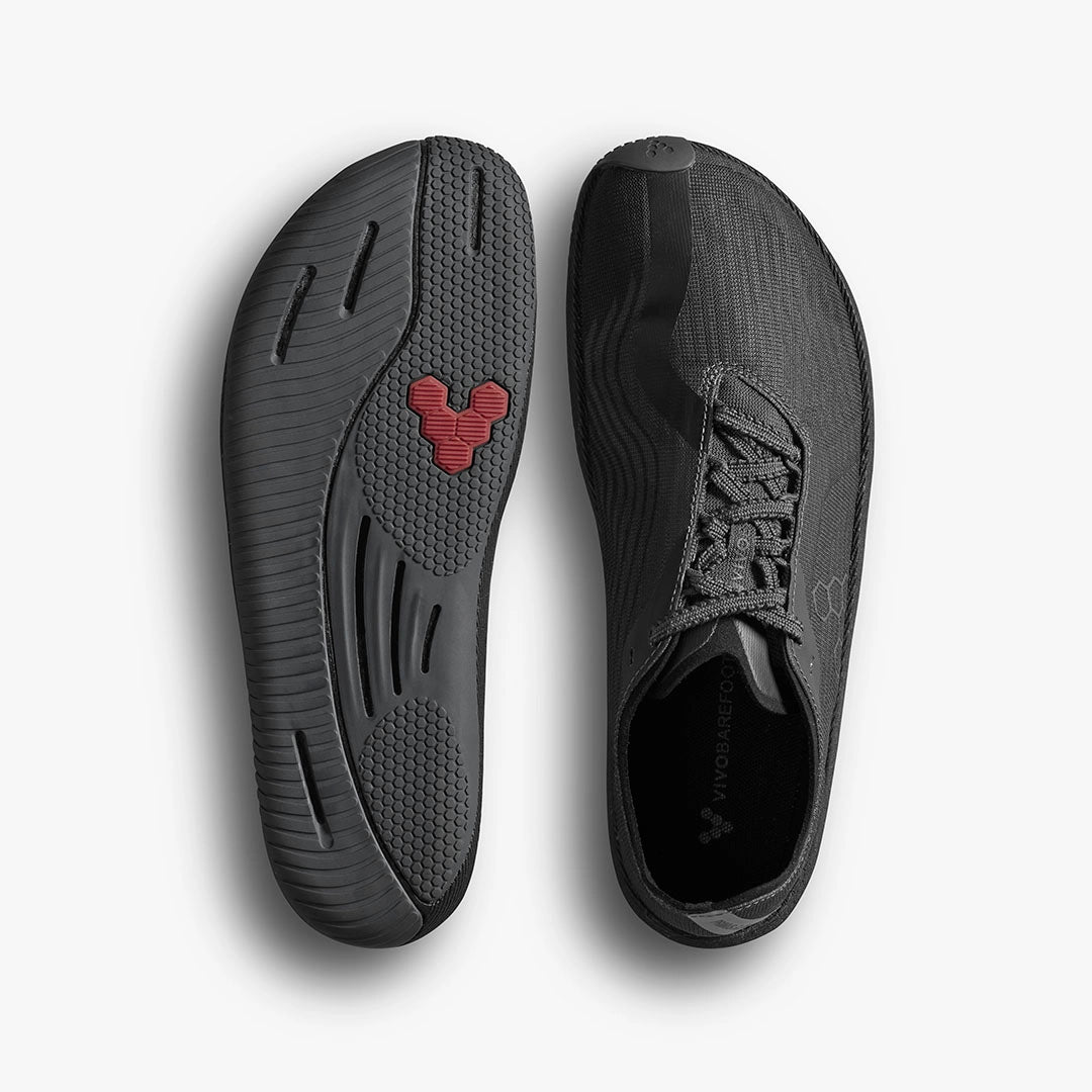 Dark shadow Vivobarefoot men's Primus Flow minimalist shoe with lace-up front and flexible sole.