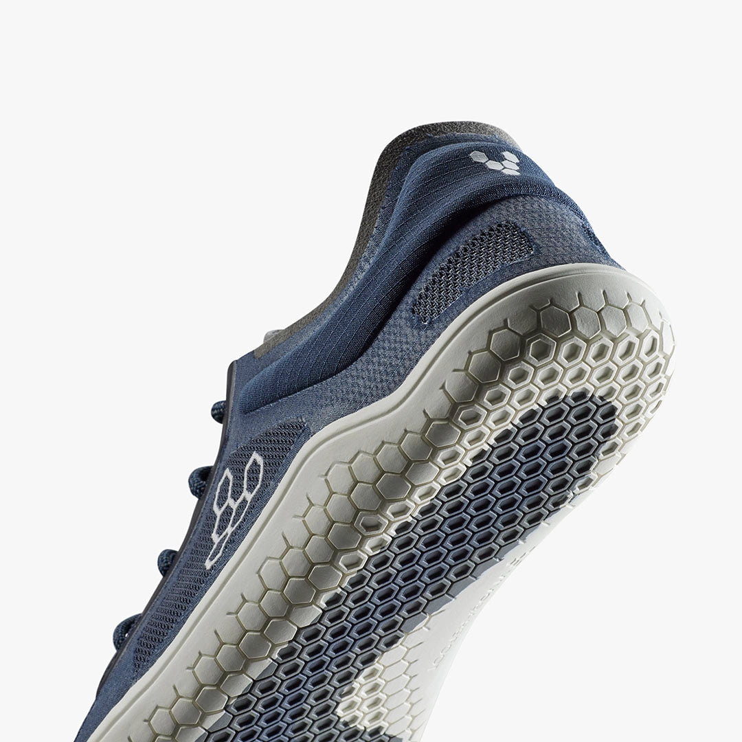 Navy blue Vivobarefoot Primus Lite 3.5 sneaker with hexagonal tread sole and breathable mesh upper.