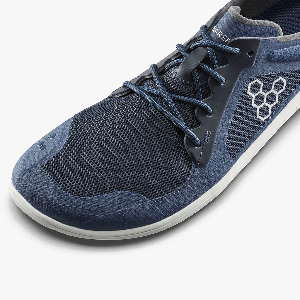 Midnight blue lightweight mesh athletic shoe with minimalist sole and honeycomb logo on side.