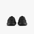 Pair of black Vivobarefoot Primus Lite 3.5 athletic shoes shown from the rear with textured soles and minimalist design.