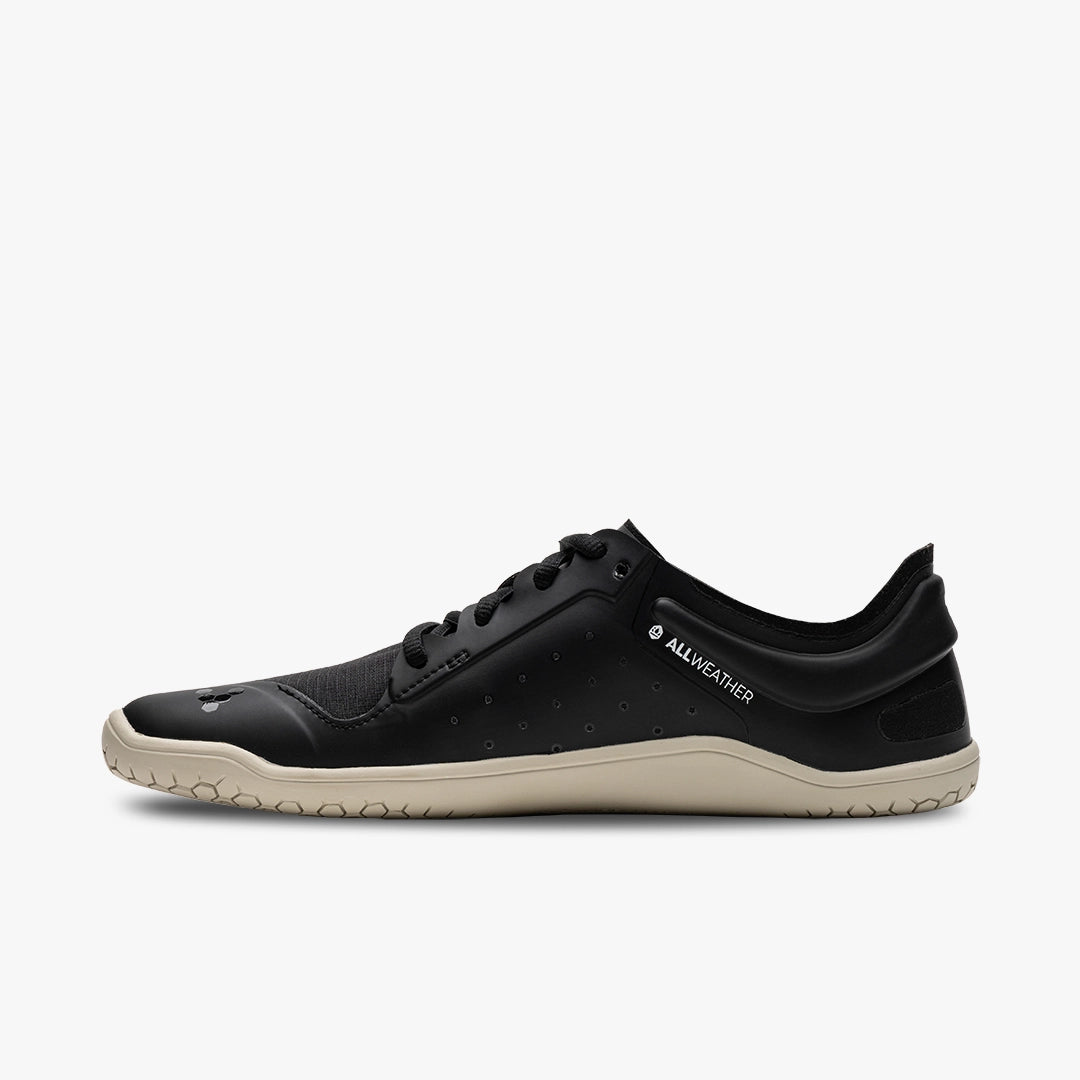 Black low-profile Vivobarefoot athletic shoe with beige sole and minimalist design.