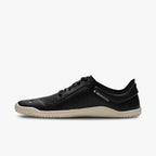 Black low-profile Vivobarefoot athletic shoe with beige sole and minimalist design.