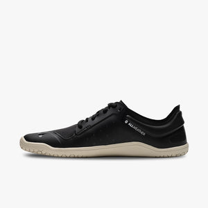 Black low-profile Vivobarefoot athletic shoe with beige sole and minimalist design.