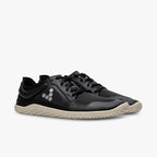 Black Vivobarefoot Primus Lite IV All Weather sneakers with textured beige soles and minimalist design.